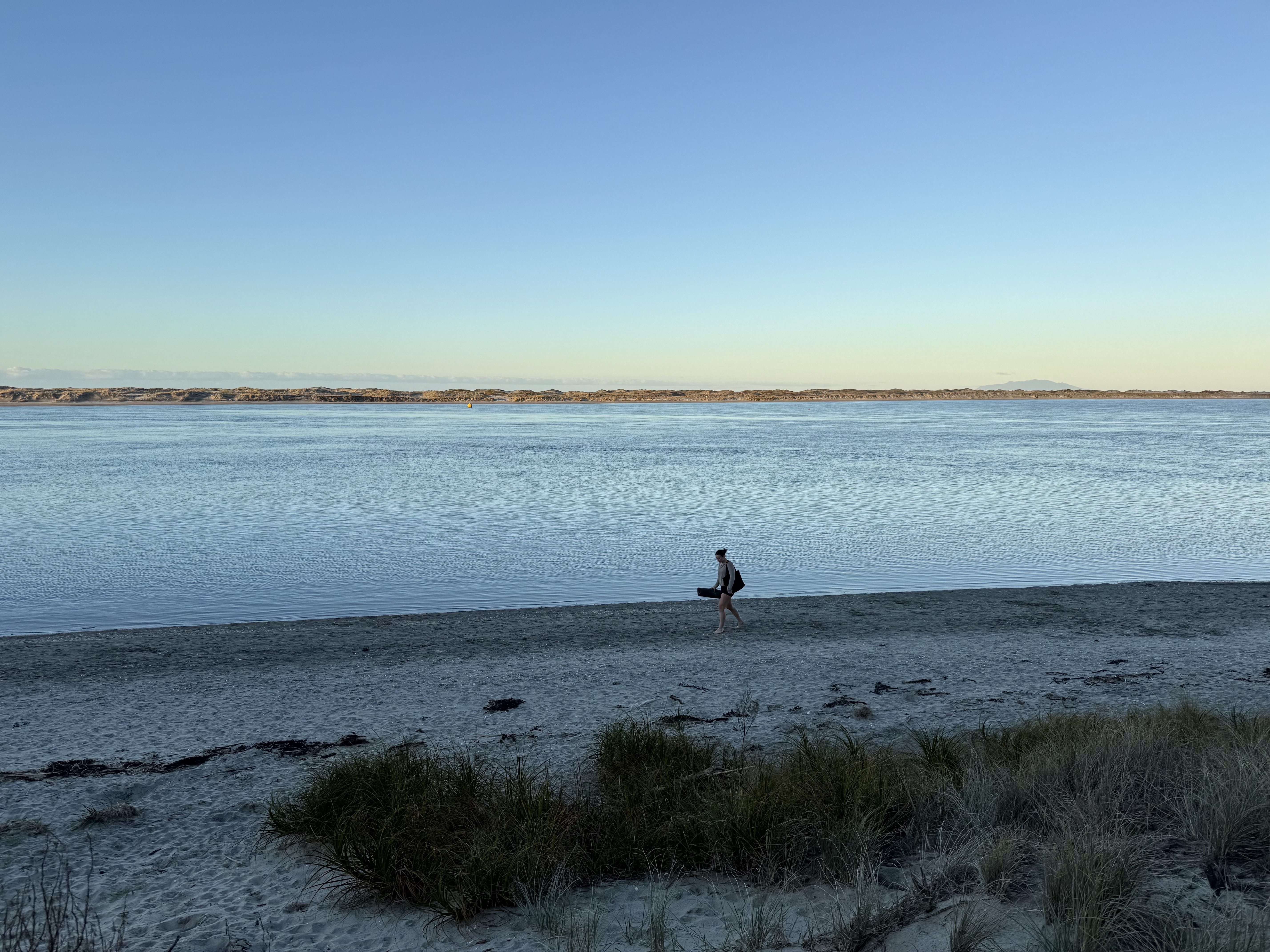 Kate on location, walking the estuary shoreline at dawn